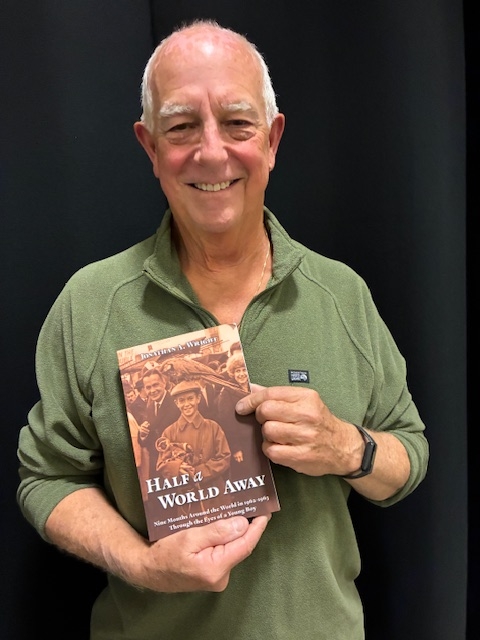 Jonathan A. Wright, author, holding his book Half a World Away